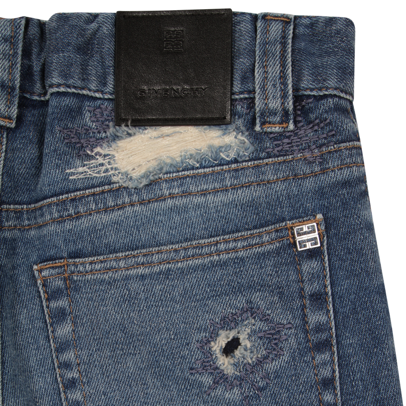 Long worn-out denim jeans